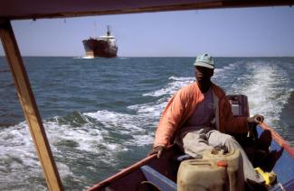 Overfishing is a global issue: Japanese trawler competing with African fishing boat near Senegal’s coast.