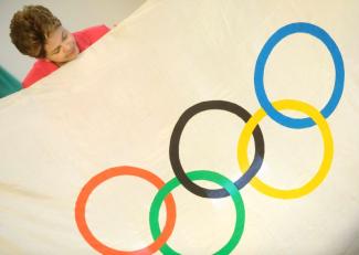 Dilma Rousseff with Olympic flag in 2012.