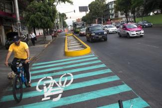 To fight air pollution in the capital city, Mexico is using driving bans and cycling paths.
