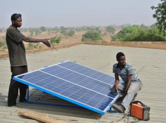 Installing a solar home system.