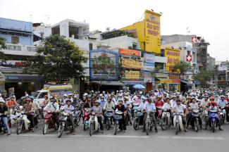Moped riders in Ho Chi Minh City.