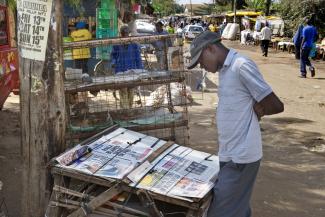 Literacy rates have risen, and more countries now enjoy the freedom of the speech than in the 1980s: newspaper stand in Nairobi.