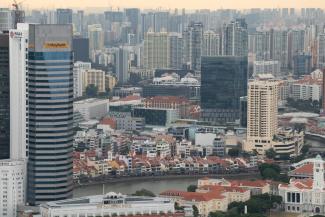 Private condominiums and public housing projects side by side in Singapore.