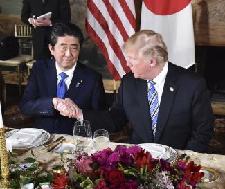 Snubbed: Shinzo Abe visiting Donald Trump in April.