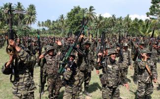 MILF fighters hail the signing of the peace agreement in October 2012.