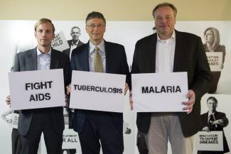 Shared concern: Dirk Niebel and Bill Gates with Mark Dybul, the executive director of the Global Fund to Fight AIDS, Tuberculosis and Malaria at a photo opportunity during the World Economic Forum in Davos in January 2013.